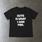 Cute Is What I Aim For toddler tee in black, laid flat