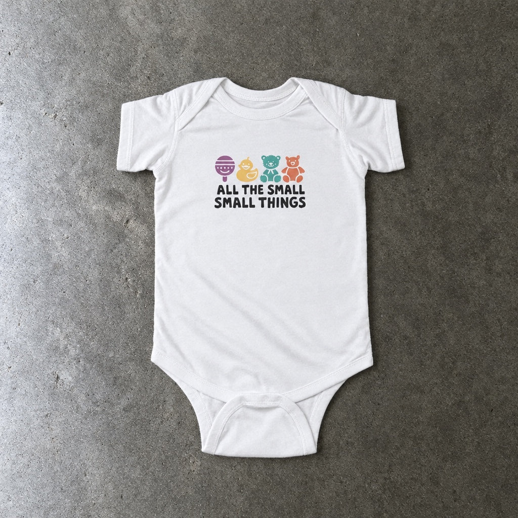 All The Small Things Colorful onesie in white, laid flat