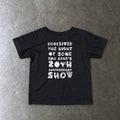 Conceived the Night of Some Emo Band's 20th Anniversary Show Baby Tee in black, laid flat