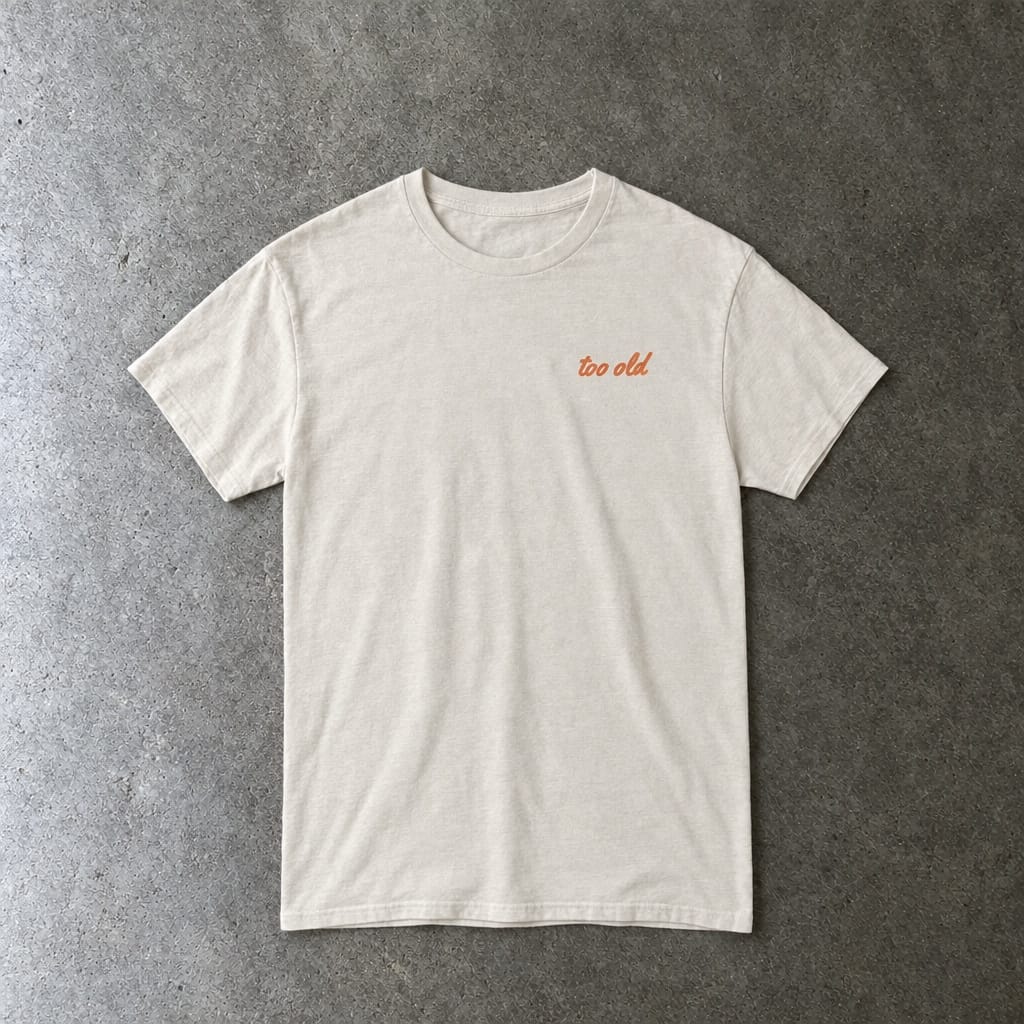 I'm Too Old For This Pit Danny Tee in natural, laid flat