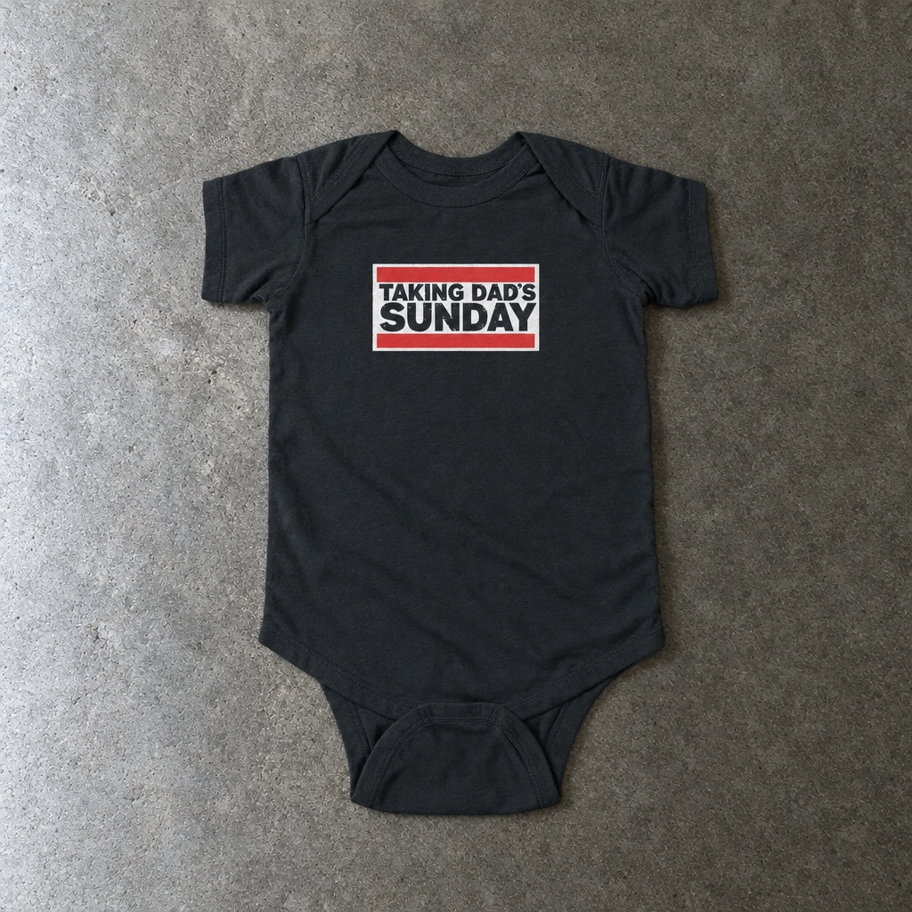 Taking Dad's Sunday onesie in black, laid flat