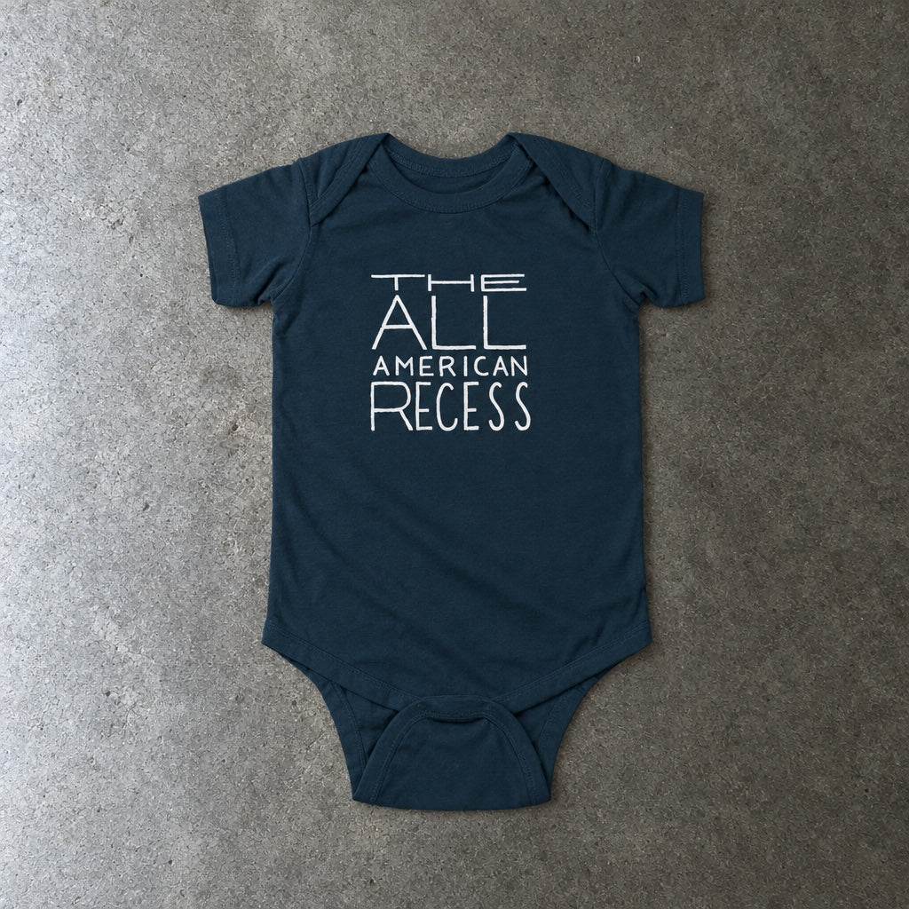 The All-American Recess onesie in navy, laid flat