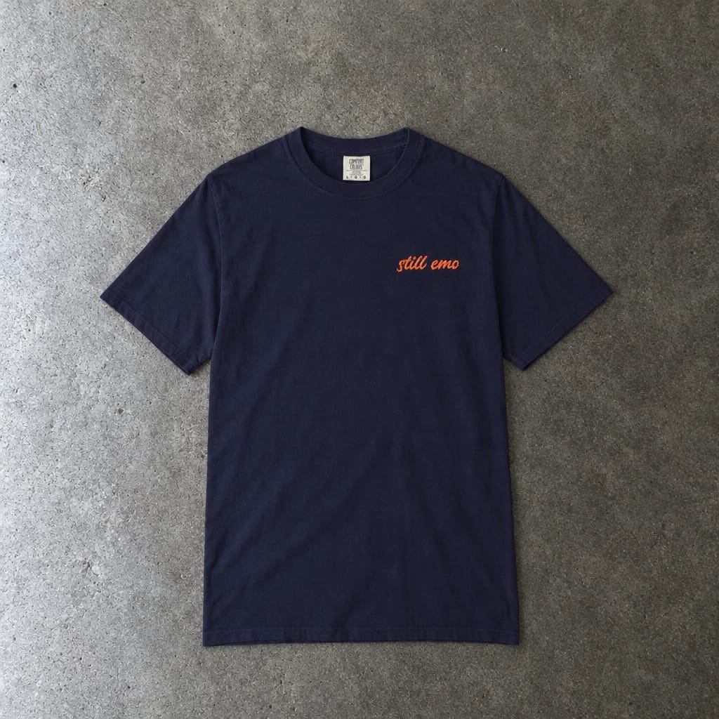 Still Emo Embroidered Tee in true navy, laid flat